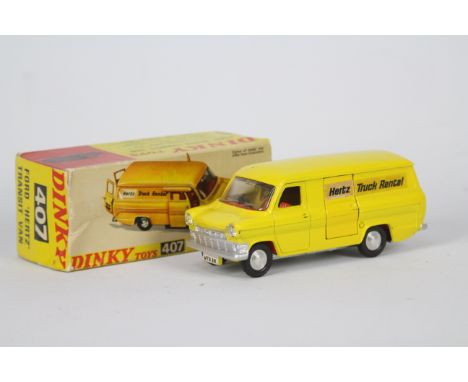 Dinky - A boxed 1970s Dinky # 407 Ford Transit Mk1 in Hertz yellow livery with a silver base. The model appears in Very Good 