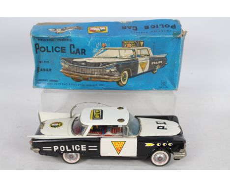 Ichiko - Langcraft - A boxed Ichiko 1959 Buick Police Car with Radar # IK4062. The car is 28 cm long with a friction motor wh