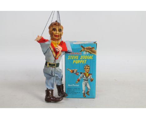 Fireball XL5 - A boxed 1960s Steve Zodiac Puppet. This hand painted plastic marionette is approximately 23 cm tall and appear