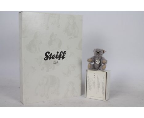 Steiff - A boxed miniature alpaca  'Annual Gift 2010' bear - The grey bear has plastic eyes, wool felt paws and nose. Jointed