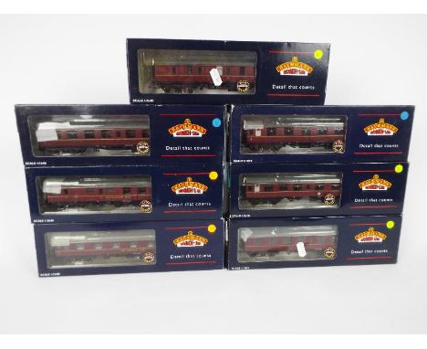 Bachmann - seven OO gauge maroon corridor coaches, # 39-026B, 39-051C, 39-103, 39-126, 39-151A, 39-176 and 39-251A, all appea