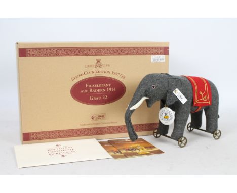 Steiff Felt Elephant on wheels 1914 replica, Grey 22.  A Steiff Club Edition replica 1997/98. A grey wool felt elephant stuff