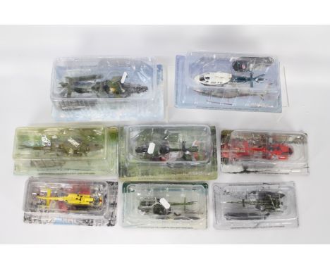 Amercom - 8 x 1:72 scale blister-packed die-cast model helicopters, 15 x plus Amercom magazines, and similar - Lot includes a