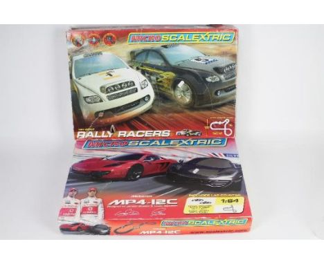 Scalextric - 2 x Micro Scalextric sets in 1:64 scale, # G1100 Rally Racers and # G1074 McLaren MP4-12C. Both sets show signs 