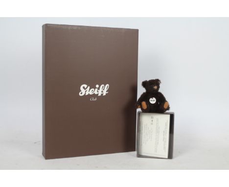 Steiff - A boxed miniature alpaca  'Annual Gift 2011' bear - The brown bear has plastic eyes, wool felt paws and nose. Jointe