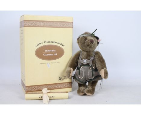 Steiff - A boxed grey mohair #00679 'Austria bear 1995 Caramel 40' - The bear has plastic eyes, wool felt paws and stitched n