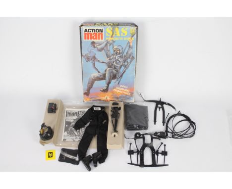 Palitoy, Action Man - A boxed Palitoy Action Man SAS Parachute Attack outfit. Contents include jumpsuit, parachute harness, p