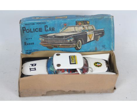 Ichiko - Langcraft - A boxed Ichiko 1959 Buick Police Car with Radar # IK4062. The car is 28 cm long with a friction motor wh