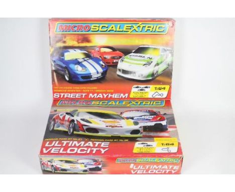 Scalextric - 2 x boxed Micro Scalextric sets in 1:64 scale, # G1051, # G1048, Street Mayhem and Ultimate Velocity. Both sets 