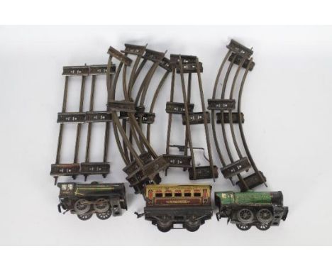 Hornby - A collection of O Gauge items including two clockwork engines, one Model 20, one Model MO, the motor works on the MO