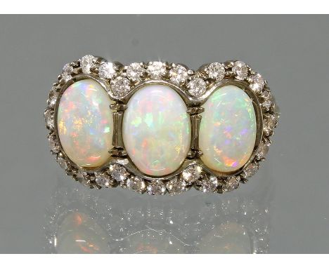 Ring, GG 750, teils weiß belötet, 3 Vollopal-Cabochons, 28 Besatz-Diamanten, 5 g, RM 18.5