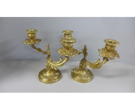 A pair of gilt bronze two branch candlesticks, 17.5cm 