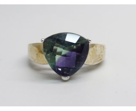 A silver gilt colour change trilliant cut fluorite ring, R 