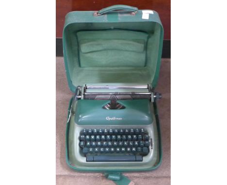 A cased Optima green typewriter, Hering toy piano and Paul Daniels Magic set **PLEASE NOTE THIS LOT IS NOT ELIGIBLE FOR IN-HO