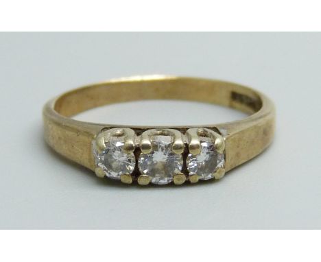 A 9ct gold ring set with three diamonds, 2.2g, M 