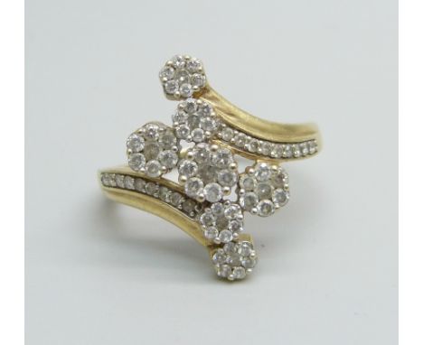 A 9ct gold and diamond encrusted ring with seven diamond clusters, 4.2g, U 