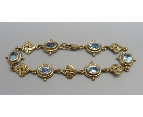 A silver gilt aquamarine Celtic design bracelet 