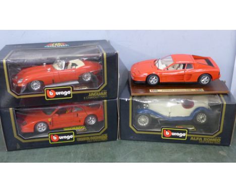 Four Burago 1/18 scale model vehicles including Ferrari Testarossa 1984 and Alfa Romeo 2300 Spider 
