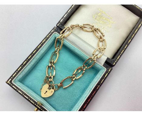 A 9ct Gold Gate Link Bracelet, (minor link damage), to 9ct gold heart shape padlock style clasp, with safety chain, 19cm long