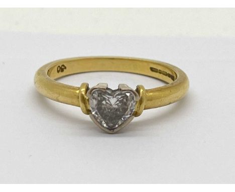 An 18ct Gold Heart-Shaped Diamond Ring, collet set between uniform band, stamped "DIA" ".50" (finger size P).  Shank appears 