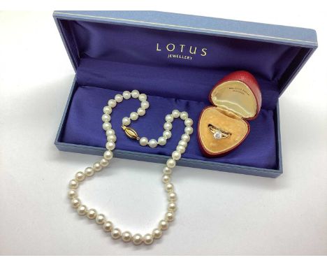 A Modern 9ct Gold Single Stone Dress Ring, claw set, plain band (finger size N); A Modern Single Strand Pearl Bead Necklace, 