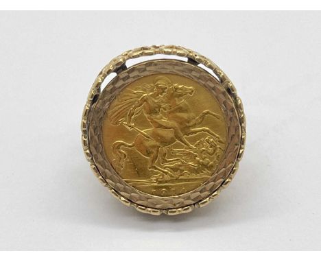 A George V 1914 Half Soverign Ring, mounted within a 9ct gold openwork setting, of pierced heart design, faceted border to ce