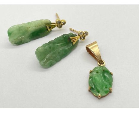 A Pair of Carved Jade Drop Earrings, each with rubover set surmount; together with an oval panel pendant.Pendant is in good c