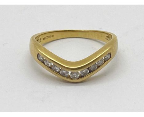 An 18ct Gold Diamond Wishbone Ring, uniform brilliant cut between tapered band, stamped "DIA" ".25" (finger size K) (2.5grams
