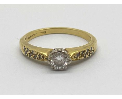 An 18ct Gold Single Stone Diamond Ring, the brilliant cut round diamond collet set between diamond set tapered band (finger s