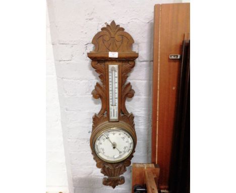 Carved oak aneroid barometer, banjo shape with scrolled outlines, thermometer over, 90cm