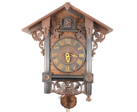 A Black Forest type stained wood cuckoo clock, double weight-driven movement, 41cm.