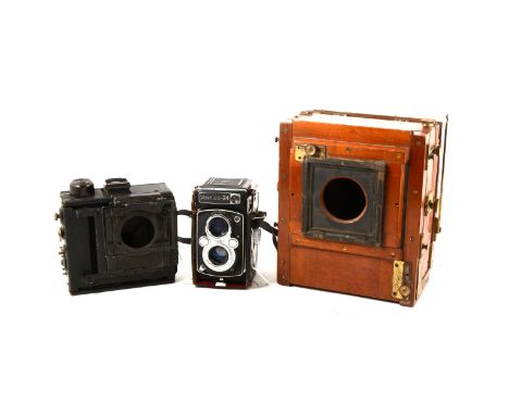 Edwardian brass mounted mahogany plate camera with spare lens, a Goerz "Tenax" vest pocket camera, cased, with plates, etc, a