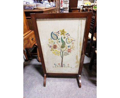 A stained walnut firescreen, with a needlework panel, width 57cm.