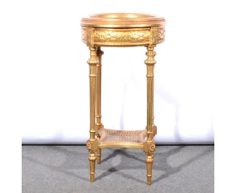 A French gold-painted stand, circular inset variegate marble top, with moulded edge, leaf pattern frieze, turned fluted legs 