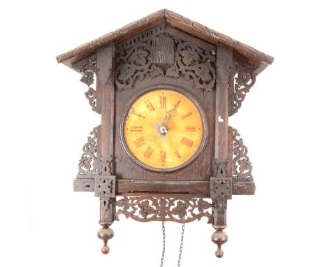 A Black Forest type stained wood cuckoo clock, double weight driven, 40cm.