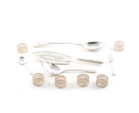 Silver fish slice, maker's mark rubbed, London 1831, a caddy spoon, Birmingham 1925, six filigree napkin rings, and other pla
