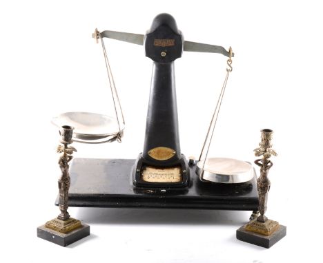 Pair of French gilt metal term demi-figure candlesticks; two Blick table-top time recorders; a set of brass beam balance scal