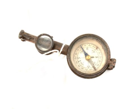 A pair of Edwardian brass, flat folding pocket binoculars incorporating a compass with mirror.