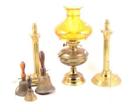 A brass oil lamp, adapted as a table lamp, amber tinted shade, with chimney 53cm; a pair of brass Corinthian column table lam