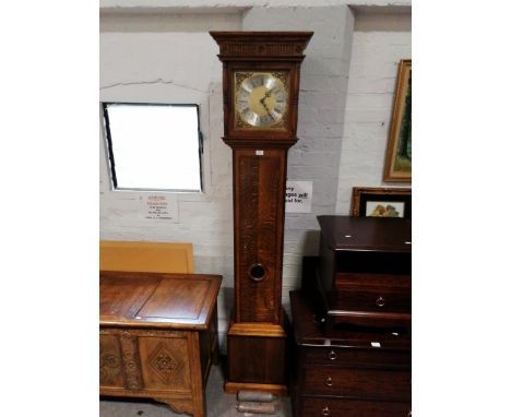 A reproduction oak longcase clock, two-chain movement, striking on a bell, 212cm.