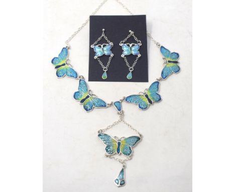 A silver and enamel butterfly necklace, and a pair of similar drop earrings (2)

Modern 