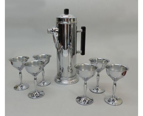 Art Deco Chrome Bakelite Cocktail Shaker And 6 Cups Martini Set.Cylindrical form, set on a circular base, detachable top cove