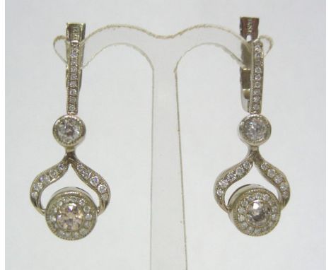 Pair of 14k White Gold 2ct Diamond Earrings.The Art Deco style earrings are set with two diamonds on the upper parts each is 