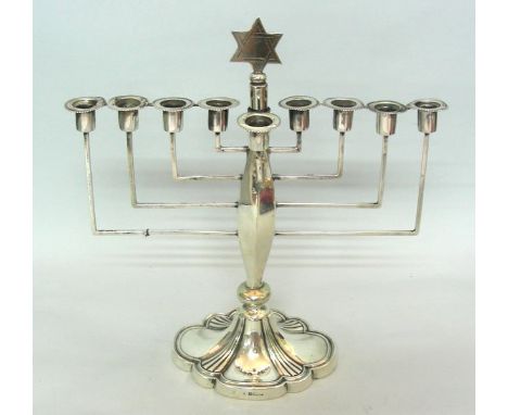 Sterling Silver Hanukkah Menorah, Birmingham, England, 1928, Judaica.Servant light (shamosh) at the center.The stem is topped