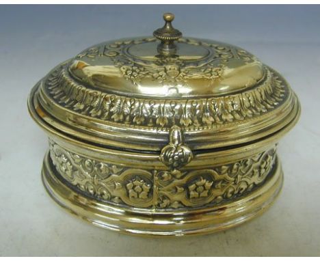 WMF B. Buch Brass Tea Caddy or Jewelry Box, Warsaw, Poland, Circa 1900.The oval hinged box is chased all around with foliage 