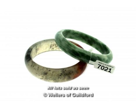 Jade bangle and a quartz bangle