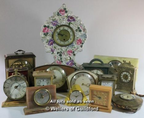 *A porcelain mantel clock and a quantity of mid 20th Century mantel and carriage clocks.