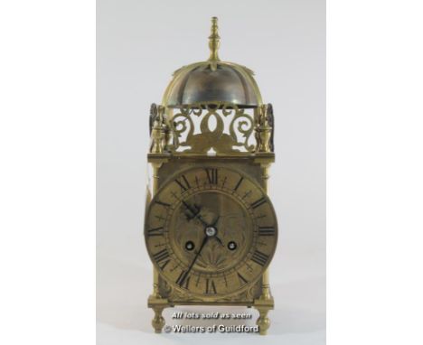 A French brass lantern clock, brass dial with Roman numerals and two train movement, the back plate stamped Made in France 66