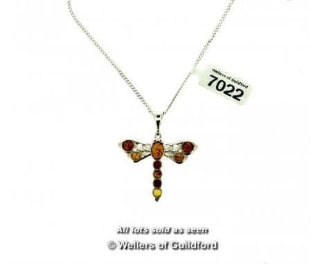 Amber dragonfly pendant, mounted in white metal tested as silver, on a white metal chain stamped as silver