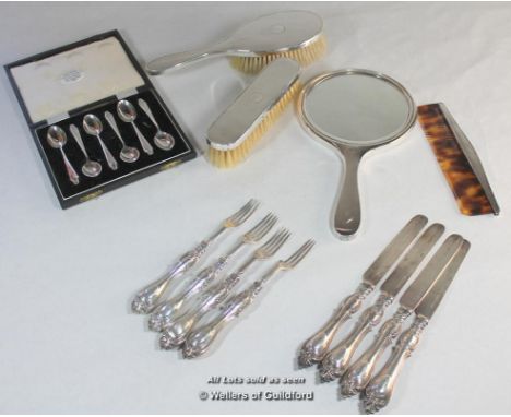 A silver four piece dressing table set comprising hand mirror, comb and two brushes, Birmingham 1970; a boxed set of six silv